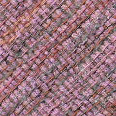 Close-up detail of handwoven woolen patterned fabric in pink and gray