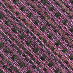 Close-up detail of handwoven woolen patterned fabric in pink and gray