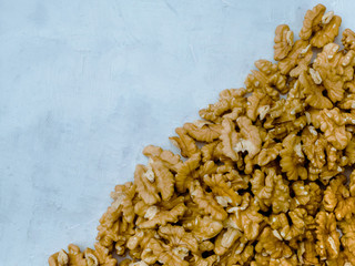 Walnuts kernel on light blue background, Top view.