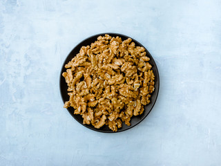 Walnuts kernel on light blue background, Top view.