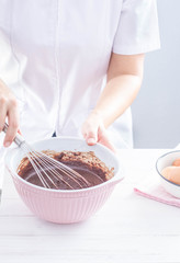 Preparing chocolate brownies, mixing batter