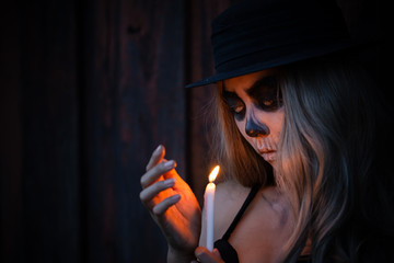 Portrait of woman make up ghost face,Mexico City’s Day of the Dead parade on Sunday honored those...
