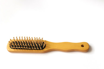 wooden hair comb on white background beauty concept, zero waste no plastic and hair salon, copyscape