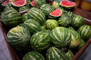 Close-up of ripe water-melons in box in supermarket