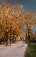 Fototapeta premium Dirt road in the old part of the city in autumn, Yoshkar-Ola ciy