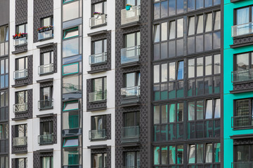 Fototapeta premium Angular view of new apartment building wall