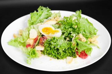 Caesar Salad on a black background