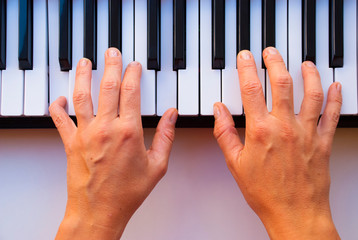 Woman hands with piano. Music background.
