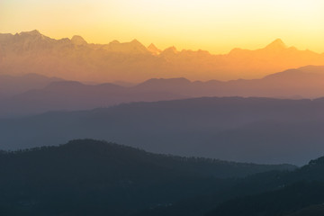 Dawn light hits the peaks of the Himalayan panorama as seen from the Indian town of Kausani in Kumaon, Uttarakhand.