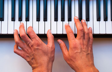 Man fingers with piano. Pianist with instrument. Music background.