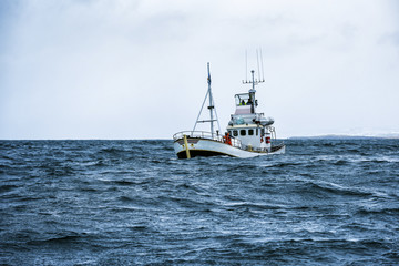fishing boat in open ocean