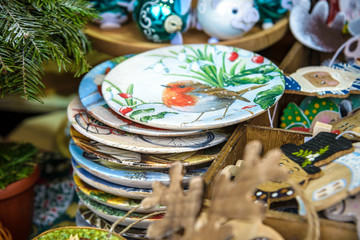 Different decoration, toy for xmas tree on christmas market, close up of cozy handmade toys