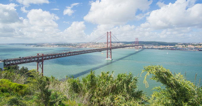 Stunning pictures of the Ponte 25 de Abril bridge - Over 2km-long, this striking Golden Gate-style bridge links Lisbon with Almada in Portugal. 