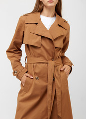Female trench coat camel color isolated on white background.
