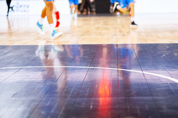 blurred background of basketball players on court during game - very shallow depht of field