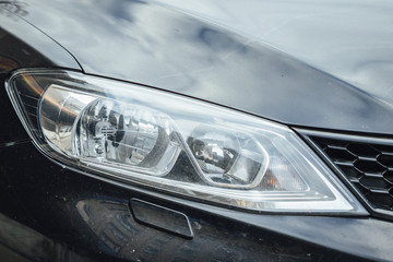 Car Headlight lamp in close up. Modern transport