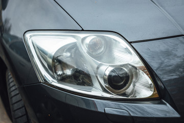 Car Headlight lamp in close up. Modern transport