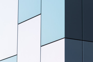 Geometric color elements of the building facade with planes, lines, corners with highlights and reflections for the abstract background and texture of white, turquoise, gray colors. Place for text