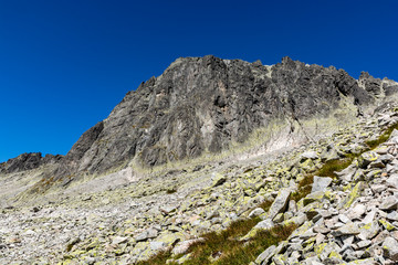 Mountain landscape. View of the wall on which mountaineers climb to get to the top - Baranie rohy (Baranie Rogi). Tatra Mountains, Slovakia.