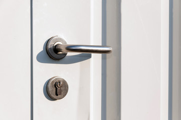Entrance door handle close up. Lock and handle on the door.