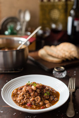Hearty Bean Stew with Meat and Pepper in White Plate
