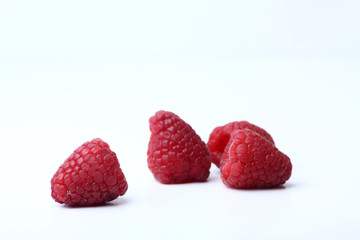 a group of raspberry on white background