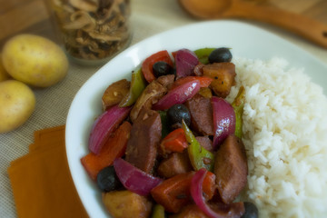Food photography of a Portuguese stir fry dish with rice.