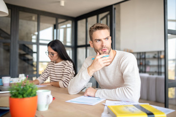 Man feeling concerned after feeling tax declaration