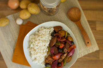 Food photography of a Portuguese stir fry dish with rice.