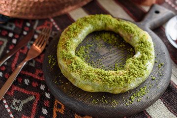Traditional Turkish Pastry Dessert with Clotted Cream and Pistachios, Simit Katmer