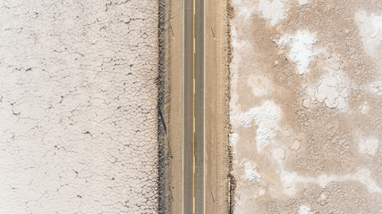 Aerial view of road crossing Salinas Grande, touristic attraction, Argentina.
