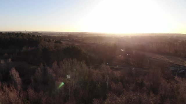 English Wooded Countryside, Railway Tracks, West Midlands, Sunrise, Drone Aerial Flying Backwards, Winter.