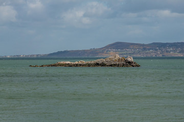 The Mainland Mirroring an Island from the Sea