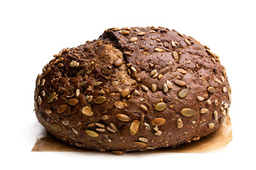 Wholemeal rye bread with sunflower and pumpkin seeds isolated on white