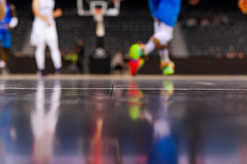 blurred background of basketball players on court during game - very shallow depht of field
