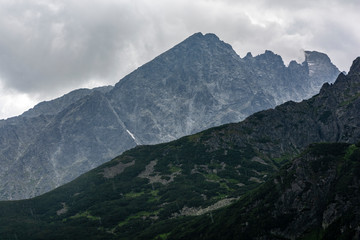 Fototapeta premium Cloudy day. View of the mountain landscape during the rain.