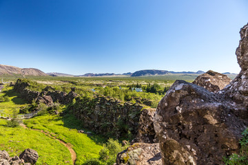 View on cliffs of continental fault of Thingvellir in Iceland on a sunny day in summer 2017