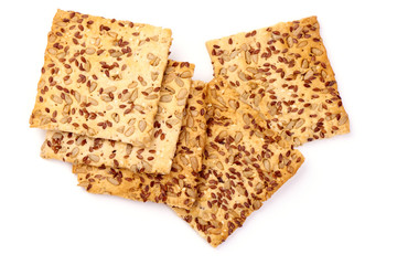 Crispy breads with sesame and flax seeds, crackers, isolated on white background