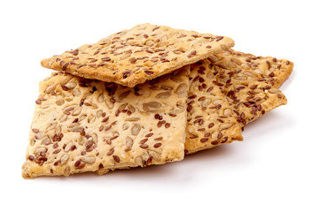 Crispy crackers with sesame and flax seeds, isolated on white background