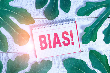 Conceptual hand writing showing Bias. Concept meaning inclination or prejudice for or against one...