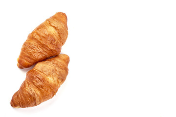 Freshly baked croissants, isolated on white background