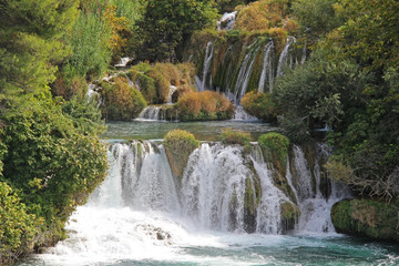 Fototapeta na wymiar Beautiful Skradinski Buk Waterfall In Krka National Park in early autumn, famous travel destination in Dalmatia of Croatia. Europe.