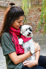 Beautiful Smiling Woman Hugging  Her Cute Havanese Dog with Red Scarf .Fashion for Owner and Dog .