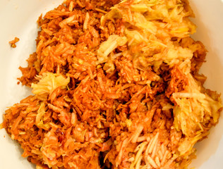 Apples grated on a grater appetizing looking brown juicy apples. Natural homemade pie