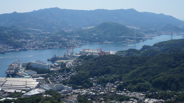 Aerial panorama of the seaport in Nagasaki city from the mount Inasa observation platform, Kyushu, Japan.