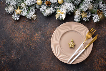 Christmas table setting and golden decor