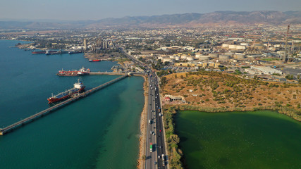 Obraz premium Aerial drone photo of industrial refinery of Hellenic Public Petroleum company in gulf of Aspropirgos, Attica, Greece