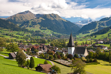 landscape near Gstaad, summer view to Saanen Church and village