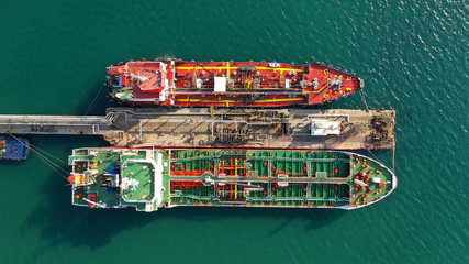 Aerial drone top view photo of industrial LPG gas and fuel container tanker docked in Mediterranean port
