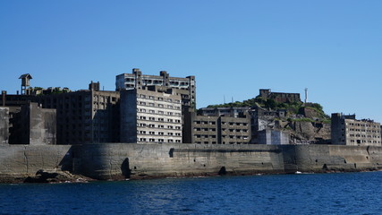 Gunkanjima is an abandoned city of a coal miners on the Hashima island in Japan. Panoramic view.